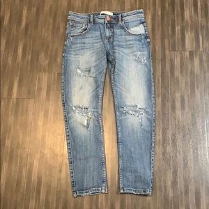 Distressed straight leg jeans.